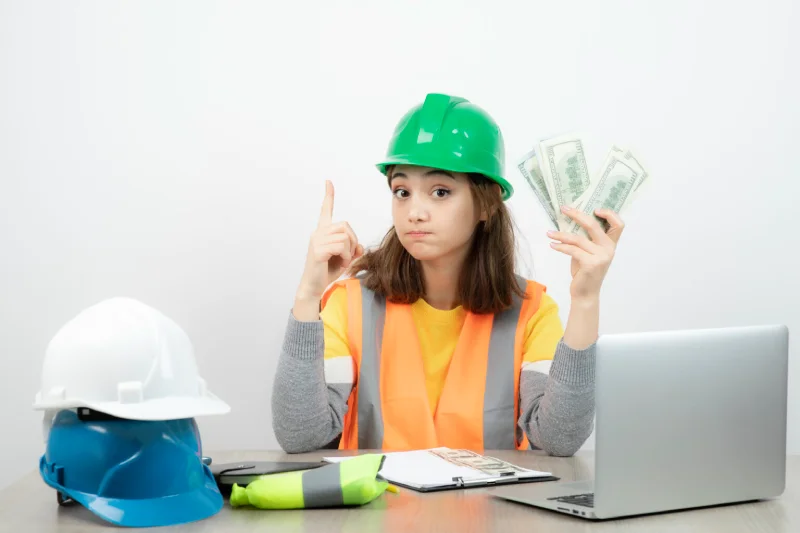female worker holding money in hand 1536x1024 1 1